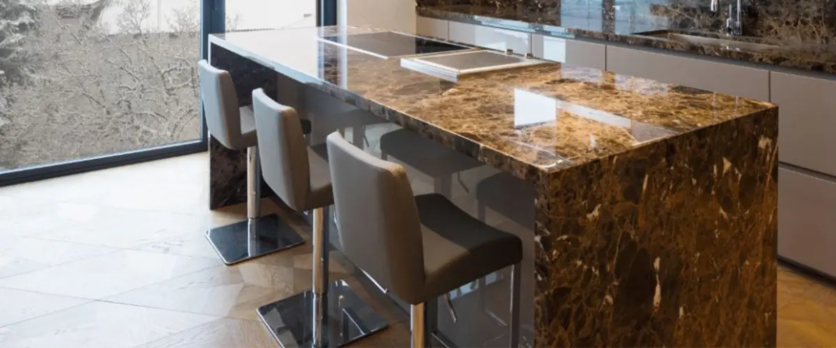 dark marble waterfall countertop kitchen island