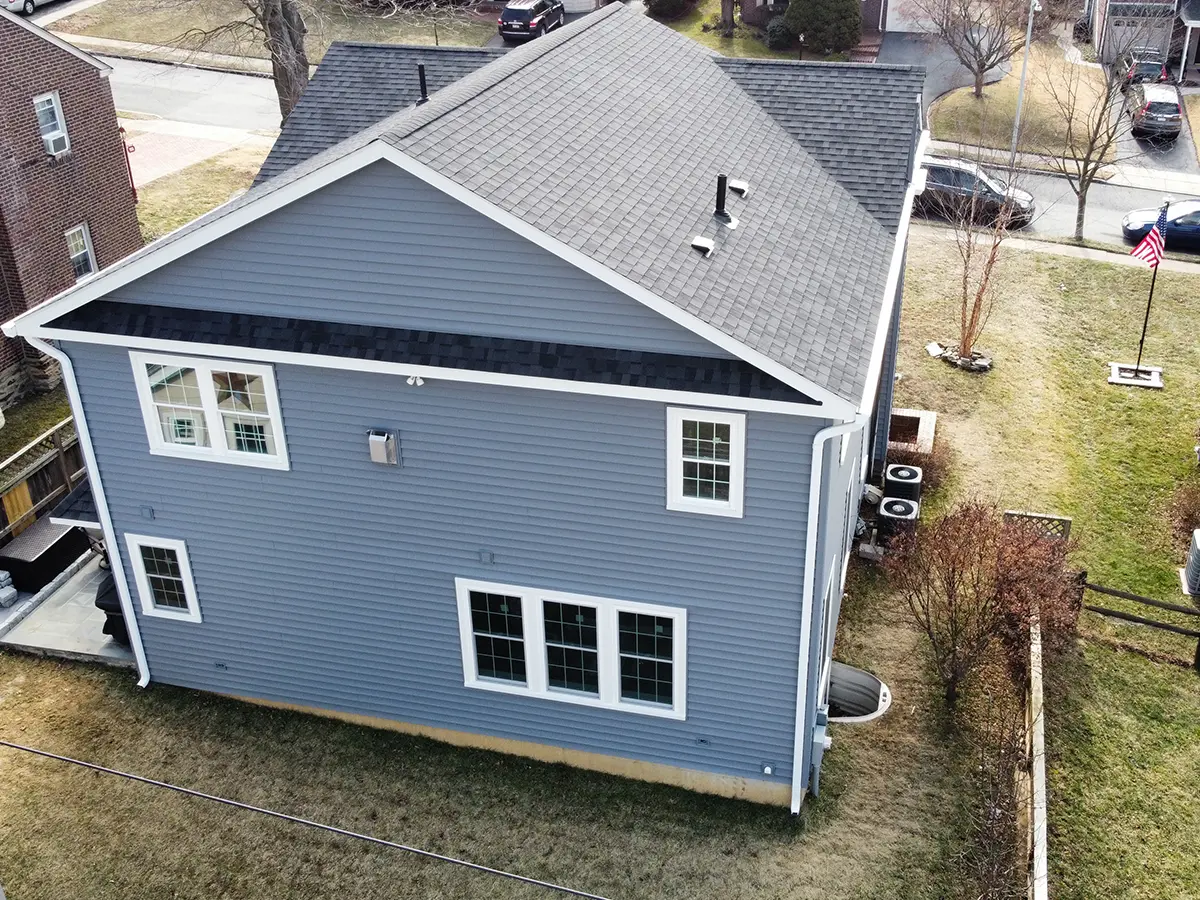 A large home with blue siding