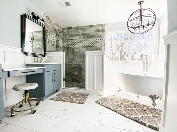 A new bathroom with a free standing tub and a glass walk-in shower