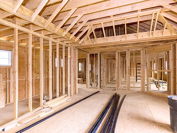 The wood frame and the drywalls of a home, exposed in the interior of the home