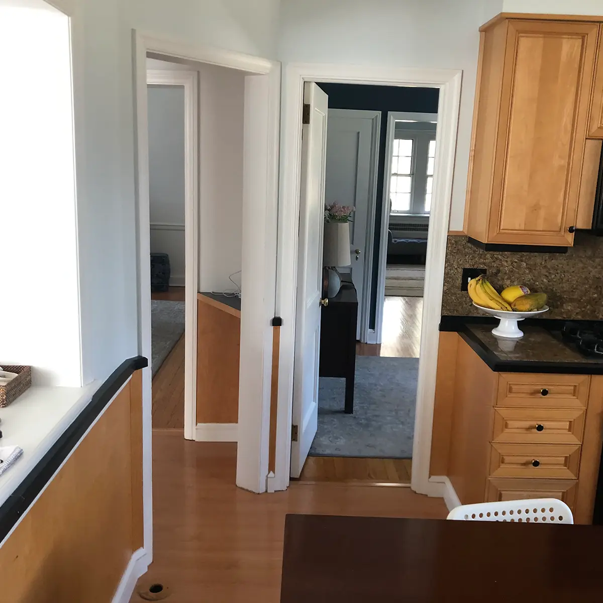 A dated kitchen with old wood cabinets